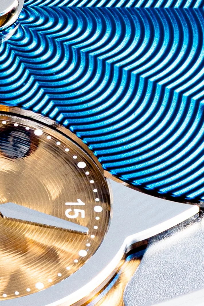 Macro detail of the Azure guilloché and the hammered gold small-seconds register